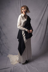 white silk dress that merges the style of an oversized shirt