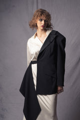 white silk dress that merges the style of an oversized shirt