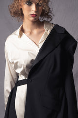 white silk dress that merges the style of an oversized shirt