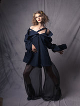 oversized denim shirt with straps, exposing the shoulders