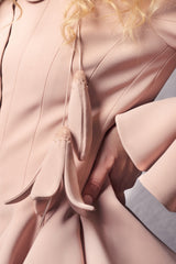 jacket featuring wavy panels at the hem and sleeves with hand made lilies