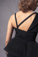 black asymmetric Basque jacket that flares out at the back