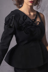 black asymmetric Basque jacket that flares out at the back