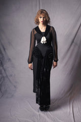 Sleek black dress with a touch of 1920's style