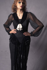 Sleek black fitted dress with a tasteful back slit with a touch of 1920's style