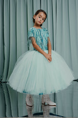 aristocrat kids gowns . Statement gown with a full princess skirt layered in feather-light airy tulle with a 100 % silk lining.