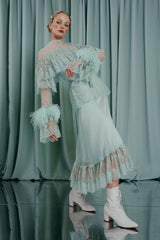 couture clothing Romantic maxi dress with lace ruffles and natural ostrich feather trim at the cuffs.