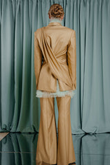 couture clothing sophisticated silk organza blouse with numerous hand made pleats. A high ruffled collar and ruffle detailing at the hem and the cuffs.