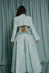 Aquamarine wide-leg trousers, complete with an amber-embroidered bodice