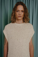 couture for teens  soft hand-knitted sleeveless top with glass pearl detailing.