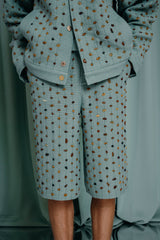 luxury kids clothing Straight-leg tailored shorts in mesmerizing Bermuda teel colored linen hand woven with a delicate touch of sparkling gold.  Fully embroidered front with natural amber and gilded beads