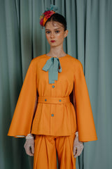 Luxury clothing for girls cape portrays an unexpected revelation at the back