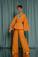 kids clothing for occasions Clean-cut palazzo trousers in bright orange with folds and a surprise revelation in the back - a splash of bright colors! Hand painted splashes.