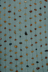 embroidered with natural amber