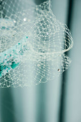 couture for kids features a delicate netting embellished with exquisite glass beads, pearls, and crystals,
