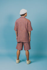 Oversized linen safari shirt with four pockets.
