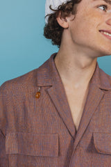 Oversized linen safari shirt with four pockets.