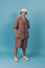 Relaxed-fit, wide-leg linen shorts with front button closure and two silk-lined pockets.