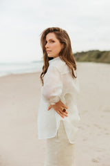 Gracious soft white, transparent organza blouse without buttons.