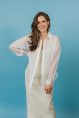 Gracious soft white, transparent organza blouse without buttons.