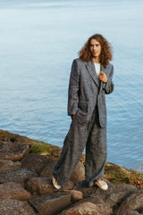 Elegantly tailored oversized suit jacket made of indigo blue silk linen.