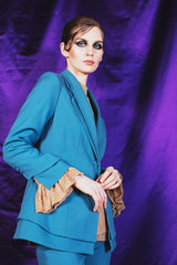 Sky blue single button jacket with a double lapel and two side pockets.