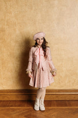 Golden-rose tweed jacket with four front pockets.