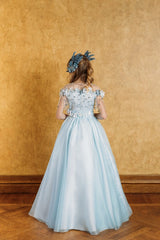 Delicate blue swan feather accessory with crystals.