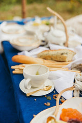 This delicately handcrafted porcelain cup and saucer set is unadorned and beautiful in its modesty.