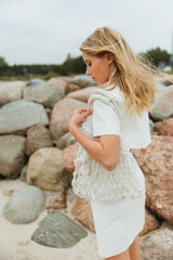 Gorgeous macrame handbag with a double handle and cotton lining expresses relaxed summer charm.