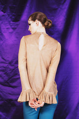 Intricately elegant golden chain knit blouse with poet sleeves and crew collar.