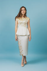 Royal silk duchess top with ruffle bottom that will accentuate the waistline.