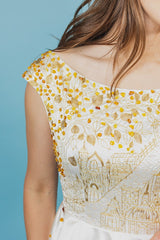 Royal silk duchess top with ruffle bottom that will accentuate the waistline.