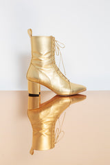 Expressive genuine leather golden block heel boots