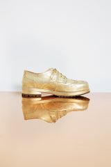 Elegant golden genuine leather Oxford shoes with leather lining and a supple rubber sole.