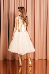 Creamy white midi princess dress with a full tulle skirt lined in pure silk for an irresistible volume and comfort.