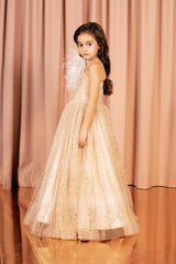 Off the shoulder sparkling princess golden ball gown with a full skirt and a layered upper part.