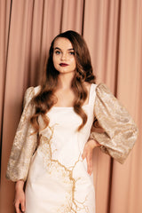 Beautifully unique mini dress in luxurious golden crack design with a square neckline and bishop sleeves.