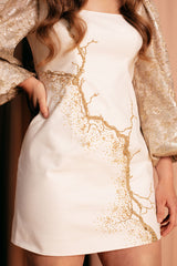 Beautifully unique mini dress in luxurious golden crack design with a square neckline and bishop sleeves.