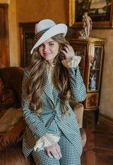 Delicate lucid white fedora hat with wide plaid band.