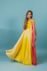 Elegantly soft, sunset-colored one-shoulder empire silk gown.