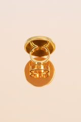 Elegant gold-plated sterling silver ring with round onyx.