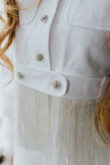 Stunning, bright bolero jacket with fringes along the sleeves, back, and bottom.