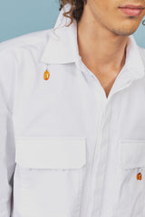 White twill cotton shirt with baseball hem that's longer on the back and rounds up on the sides.