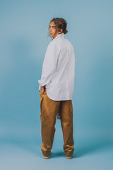 White twill cotton shirt with baseball hem that's longer on the back and rounds up on the sides.