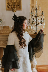 Elegant black swan feather accessory with crystals.