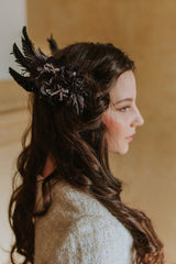 Elegant black swan feather accessory with crystals.