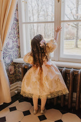 Delicate hand-crafted silk flower hair clip with golden crystal strips.