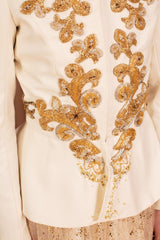 Luxurious mandarin-collar wool and silk jacket with unique Basque-stitch embroidery.