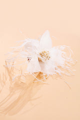 Beautifully crafted white daffodil hair pin in 100 % silk and gilded bead and ostrich feather trim.